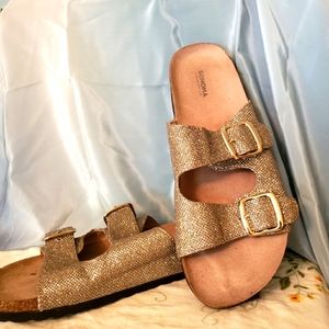 Glittery gold women's Sonoma sandals. Rubber soles. Cork cushioning. Gold buckle